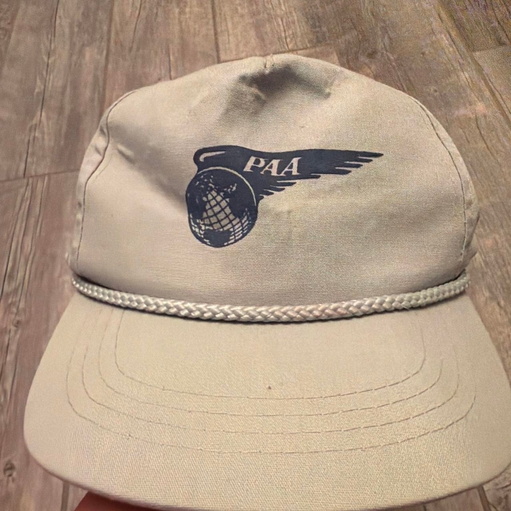 Vintage PAA cap with blue logo featuring a globe with wings and the letters
